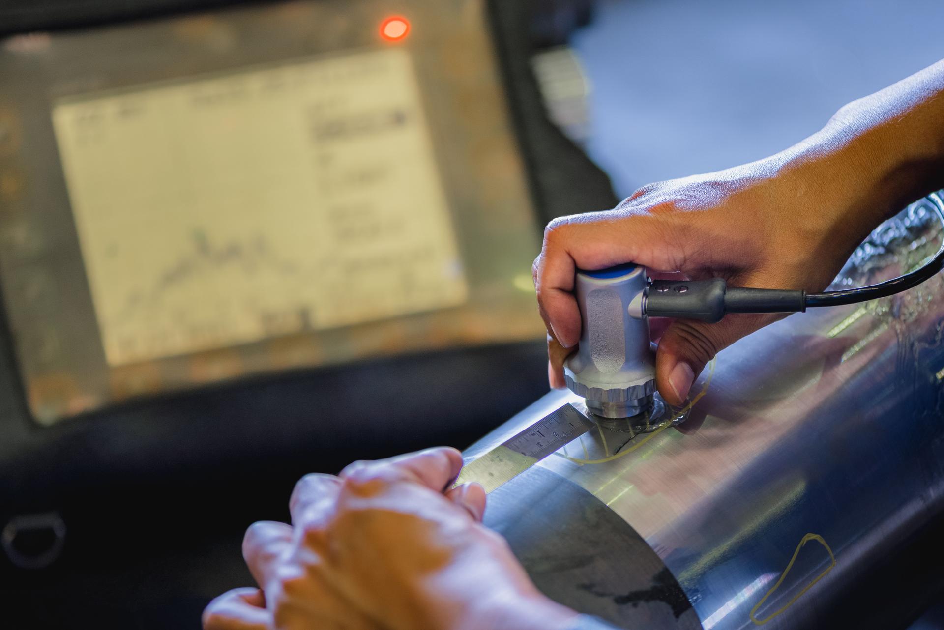 Ultrasonic test to detect imperfection or defect of round bar steel raw material in factory, NDT Inspection.